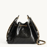 Diamant black quilted leather drawstring bucket bag with antique gold chain straps – front view
