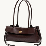 Fronde chocolate brown distressed leather shoulder bag with arc handles and tassel ties – side view
